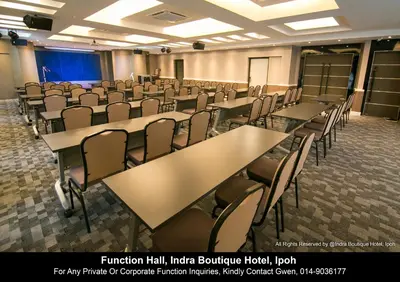a room with rows of tables and chairs at INDRA HOTEL - BOUTIQUE SUITES in Ipoh