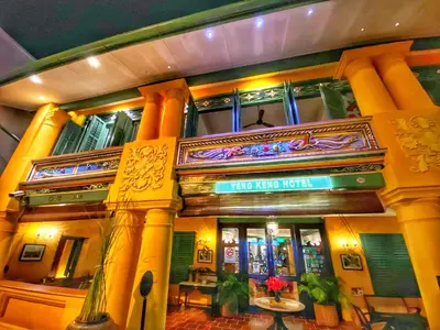 a building with a sign that reads way keep right at Yeng Keng Hotel in George Town