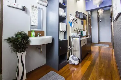 a bathroom with a sink and a toilet in a room at USM Designer Dwell in George Town