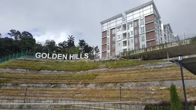 a building with the words golden hills in front of it at My 4Rooms Apartment @ Golden Hills Pasar Malam in Cameron Highlands