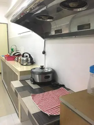 a kitchen with a stove with a pot on a counter at W9 atGoldenHills NightMarket WiFi 4R BBQ in Cameron Highlands