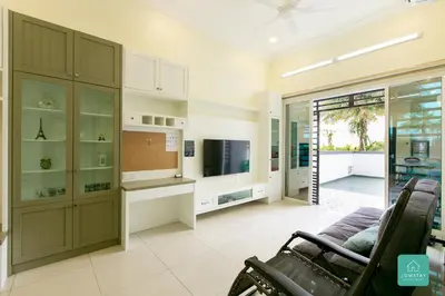 a living room with a couch and a television at JOMSTAY Majestic Ipoh Suites in Ipoh