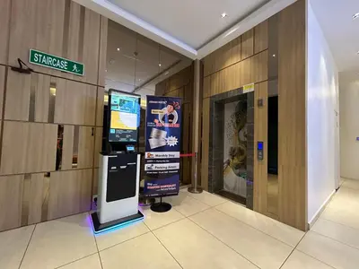 a lobby of a building with a sign on the wall at Asiago Hotel in Sungai Petani