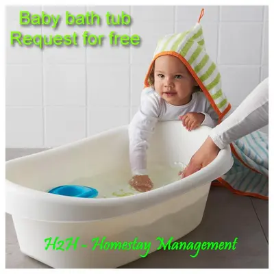 a baby sitting in a bath tub with a hat at H2H - London House @ Majestic Ipoh (8~10 Guests) in Ipoh