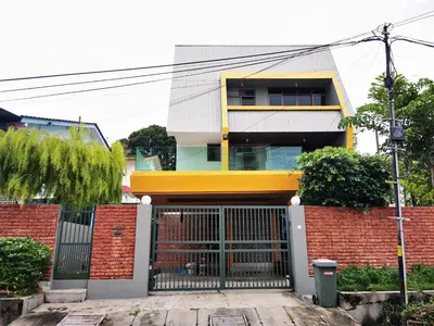 a house with a gate in front of it at Sea Lion by the beach in George Town