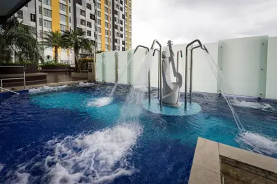 a water slide in a pool in a city at Nordiska @ Majestic Ipoh in Ipoh