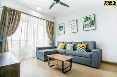 a living room with a blue couch and a table at Ipoh City Center Stardorm 2 Ipoh Homestay in Ipoh