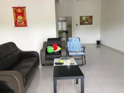 a living room with a couch and a table at My STW Home 1 in Sitiawan