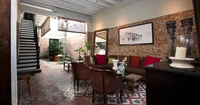 a living room with a couch and a table at Muntri Mews in George Town