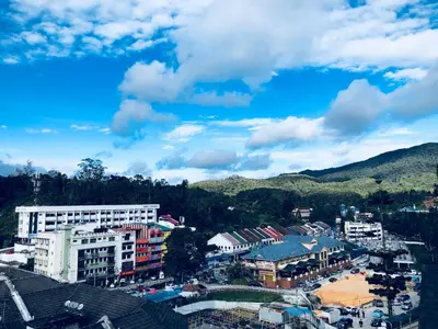 a view of a city with buildings and mountains at ATS Cameron Hotel & Apartments in Cameron Highlands