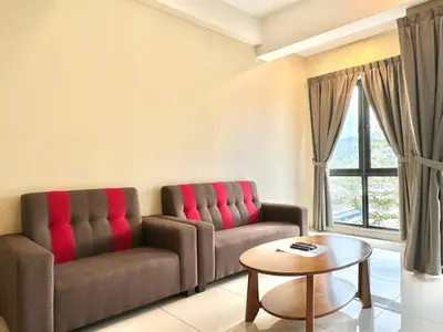 a living room with two couches and a table at Themework Homestay@Cameron Highlands in Cameron Highlands