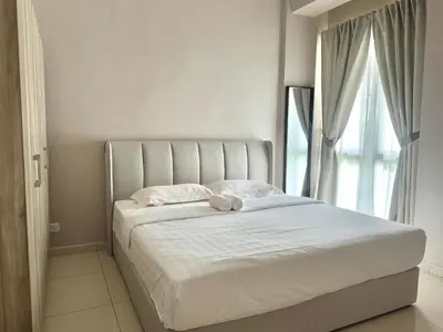 a white bed with a stuffed animal on top of it at Themework Homestay@Cameron Highlands in Cameron Highlands