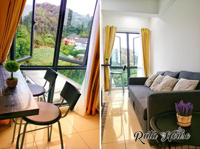 a living room with a couch and a table at Rata House in Cameron Highlands
