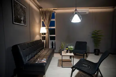 a living room with a couch and two chairs at Big Banana Hotel, Sg Petani in Sungai Petani