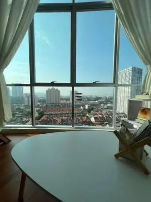 a room with a table and a large window at Compact Cozy Duplex Studio at Bayan Lepas in Bayan Lepas