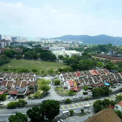 an aerial view of a city with houses and a street at Compact Cozy Duplex Studio at Bayan Lepas in Bayan Lepas