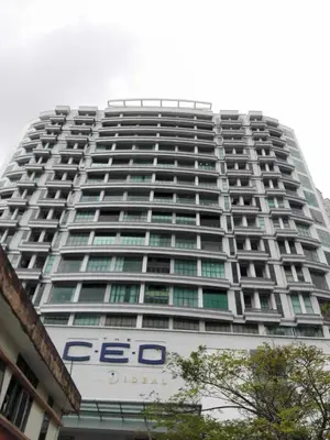 a large building with a sign on the side of it at Compact Cozy Duplex Studio at Bayan Lepas in Bayan Lepas
