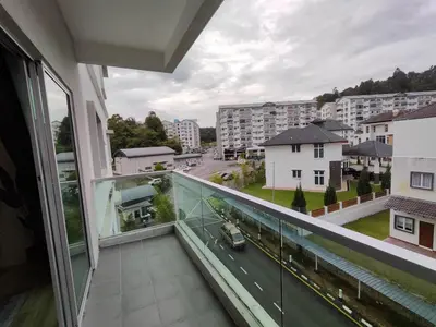 an apartment balcony with a view of a street at Family Apartment at The Quintet Cameron Highlands in Cameron Highlands