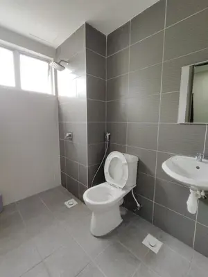 a bathroom with a toilet and a sink at Family Apartment at The Quintet Cameron Highlands in Cameron Highlands