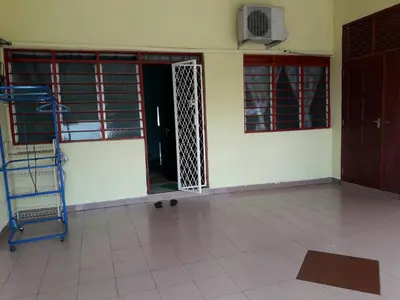 an empty room with a door and a tiled floor at Homestay Ustaz in Taiping