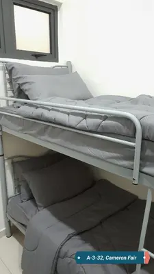 a bunk bed with a mirror on top of it at SL TR Homstay in Cameron Highlands