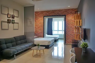 a living room with a couch and a bed at PM Octagon Ipoh Suites & Apartment 3 in Ipoh