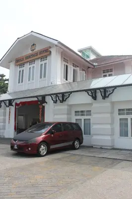 a car parked in front of a building at Chulia Heritage Hotel in George Town