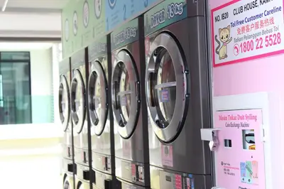 a row of washing machines in a store at The Meadow Park in Kampar
