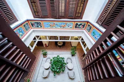 an overhead view of a building with a table and chairs at Nam Keng Hotel Penang in George Town