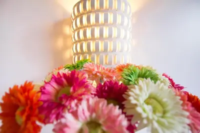 a white cake with flowers on a table at Chariton Hotel Ipoh in Ipoh