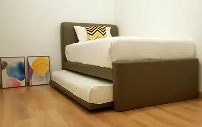 a bedroom with a bunk bed with a couch at Peony Square Residences in Cameron Highlands