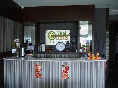 a counter in a restaurant with a clock on it at Grand Court Hotel in Teluk Intan