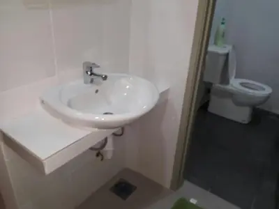 a bathroom with a white sink and a toilet at Mariana Barrington Square Goldenhills Pasar Malam Cameron Highlands in Cameron Highlands