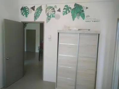 a room with a cabinet with leaves on the wall at Mariana Barrington Square Goldenhills Pasar Malam Cameron Highlands in Cameron Highlands