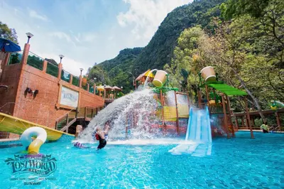 a person playing in a water slide at a water park at Sunway Lost World Hotel in Ipoh