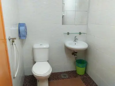 a small bathroom with a toilet and a sink at Hotel Abby IGB Tasek in Ipoh