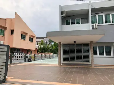 a building with a gate in front of it at D’House in Ipoh