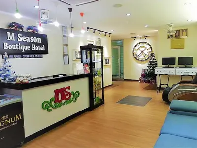 a store with a store with a christmas tree in a room at M Season Boutique Hotel Sdn Bhd in Sungai Petani