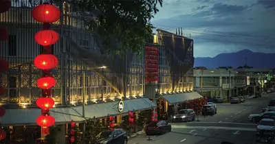 a street with red lanterns hanging from a building at 1969 Business Suites Bandar Botani, Ipoh in Ipoh