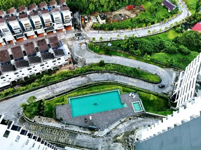 an aerial view of a building with a pool at Mr.J Homestay in Taiping