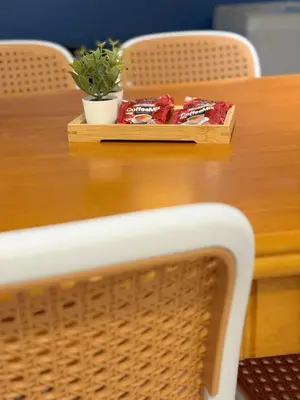 a wooden table with a tray of food on it at Taiping Centre Point Suite 10 by BWC in Taiping