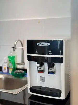a microwave sitting on a counter in a kitchen at Taiping Centre Point Suite 10 by BWC in Taiping