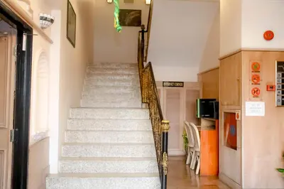 a staircase in a home with a stair case at Hotel Rainbow in Cameron Highlands