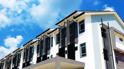 a building with black shutters on the side of it at Kampar Private Roomstay W in Kampar