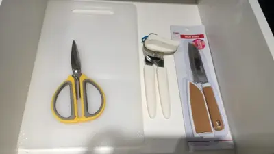 a pair of scissors and other items on a table at Misty Wonderland Cameron Next to Night Market 9 PAX in Cameron Highlands
