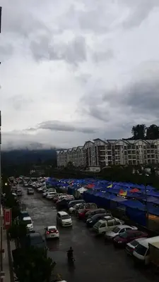 a parking lot with many cars parked in it at Blue Romance Mermaid Cameron Stay 9 pax Next to Night Market in Cameron Highlands
