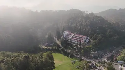 an aerial view of a building on a mountain at Wyndham Garden Shahzan Fraser's Hill in Bukit Fraser