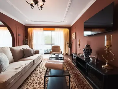 a living room with a couch and a table at Wyndham Garden Shahzan Fraser's Hill in Bukit Fraser