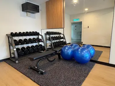 a gym with blue balloons and a bench and weights at Wyndham Garden Shahzan Fraser's Hill in Bukit Fraser