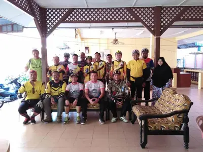 a group of people posing for a picture in a room at Nipahmas Chalet in Pangkor